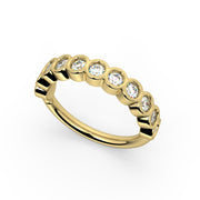 14k yellow gold bubbles seam ring with CZ bezel settings, angled overhead view on white background