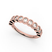14k rose gold bubbles seam ring with CZ bubble bezels, angled overhead view on white background