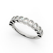 14k white gold bubbles seam ring with CZ stones in bubble bezels, top-down angled view
