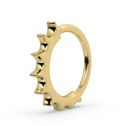 Side profile of 14k yellow gold Hades seam ring showing graduating scalloped spike detail