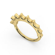 Angled top-down view of 14k yellow gold Hades seam ring highlighting the flame-inspired scalloped edge