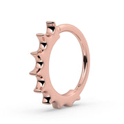 Side profile of 14k rose gold Hades seam ring showing graduating scalloped spike detail
