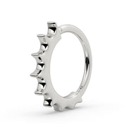 Side profile of 14k white gold Hades seam ring showing graduating scalloped spike detail
