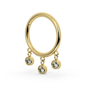 Angled side view of 14k yellow gold triple bezel dangle seam ring showing charm depth