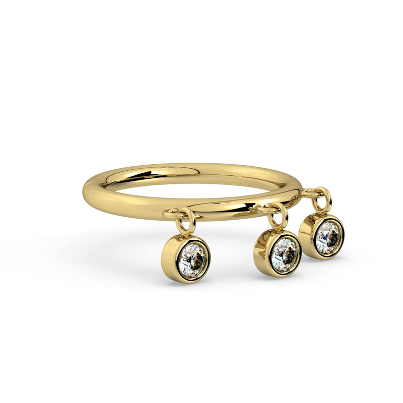 Low-angle view of 14k yellow gold triple bezel dangle seam ring highlighting dangling CZ charms