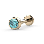 14K yellow gold aqua blue diamond bezel flat back labret stud, angled view showing post and disc