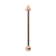14K rose gold industrial barbell with cone spike top and round ball end, front view