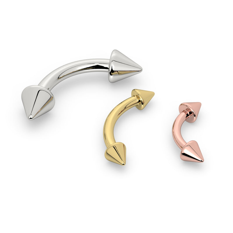 14K gold spike curved barbell in white, yellow, and rose gold variants shown together for color comparison