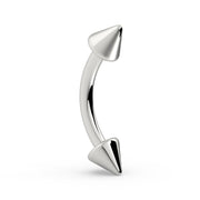 14K white gold spike curved barbell, upright side profile showing symmetrical cone spikes and curved bar