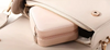 Compact pink zippered jewelry box fitting inside a handbag, showing portable travel size