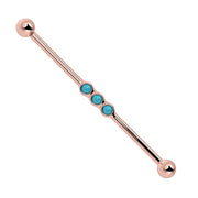 14k rose gold industrial barbell with three bezel-set turquoise cabochons, front view