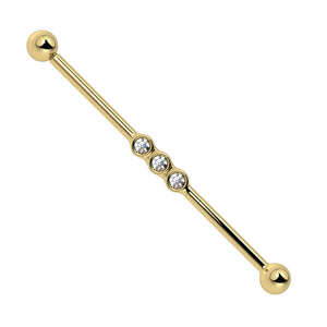 14k yellow gold industrial barbell with three bezel-set CZ gems at center, front view