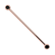 14k rose gold industrial barbell with dual bezel-set black diamonds at each end, full view