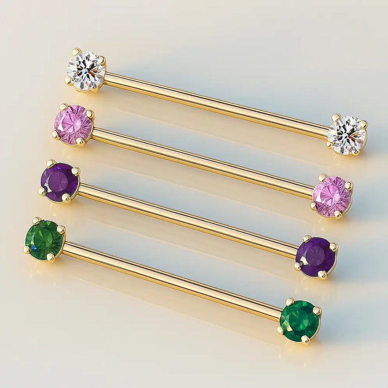 14k yellow gold industrial barbells in four CZ colors: clear, pink, purple, and green, side by side