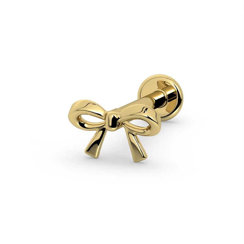14k yellow gold mini bow flat back labret stud, angled side view showing small bow and round flat back