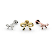 14k white gold, yellow gold, and rose gold bow flat back studs lined up front-facing for color comparison