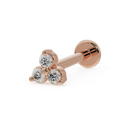 14k rose gold trinity diamond flat back labret stud, angled view showing warm-toned three-stone cluster