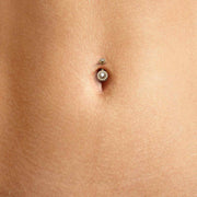 14k gold diamond halo belly ring worn in close-up navel piercing showing fit and scale