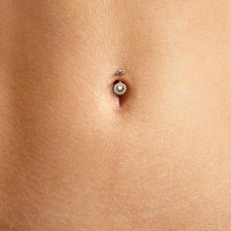 14k gold diamond halo belly ring worn in close-up navel piercing showing fit and scale