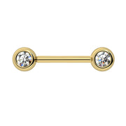 14k yellow gold CZ nipple barbell showing larger bezel-set cubic zirconia ends with brilliant sparkle