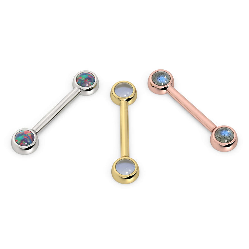 Three 14k gold nipple barbells side by side: white gold with opal, yellow gold with moonstone, rose gold with labradorite