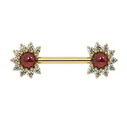 14k yellow gold nipple barbell with Mozambique garnet cabochon centers and diamond halo ends, front view