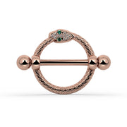 A rose gold snake nipple shield set with small green and clear stones, shown on a white background.