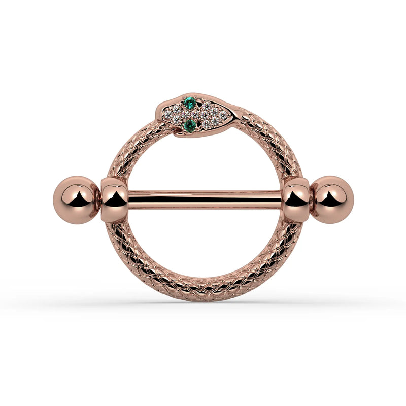 A rose gold snake nipple shield set with small green and clear stones, shown on a white background.