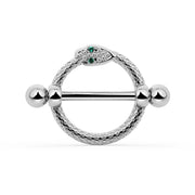 A white gold snake nipple shield set with small green and clear stones, shown on a white background.