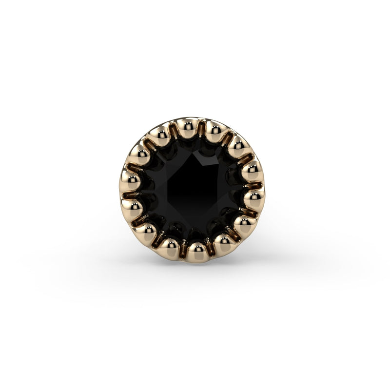 Close-up front view of 2mm black diamond milgrain bezel in 14k yellow gold nose ring end