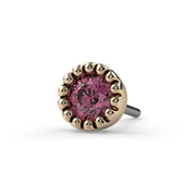 Close-up front view of 2mm pink diamond end in 14k yellow gold perlage bezel, threadless push-pin