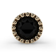 Close-up top-down view of 3mm black diamond in 14k yellow gold milgrain perlage bezel setting