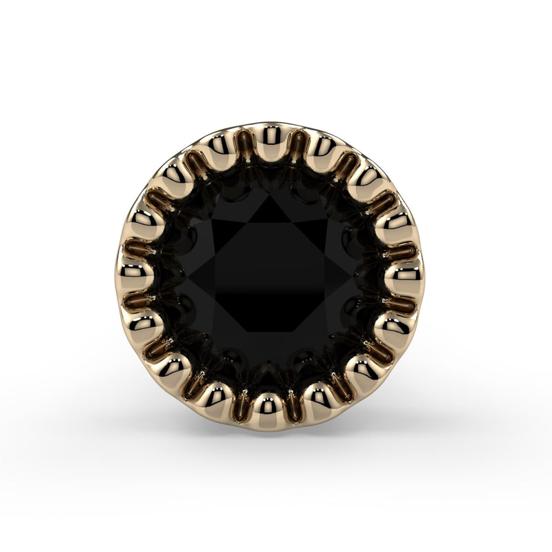Close-up top-down view of 3mm black diamond in 14k yellow gold milgrain perlage bezel setting