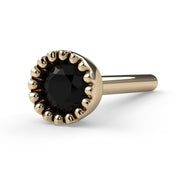 14k yellow gold black diamond perlage nose bone, slight side angle showing post and bezel profile