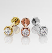 14k yellow gold, rose gold, and white gold diamond flat back labret studs shown side by side