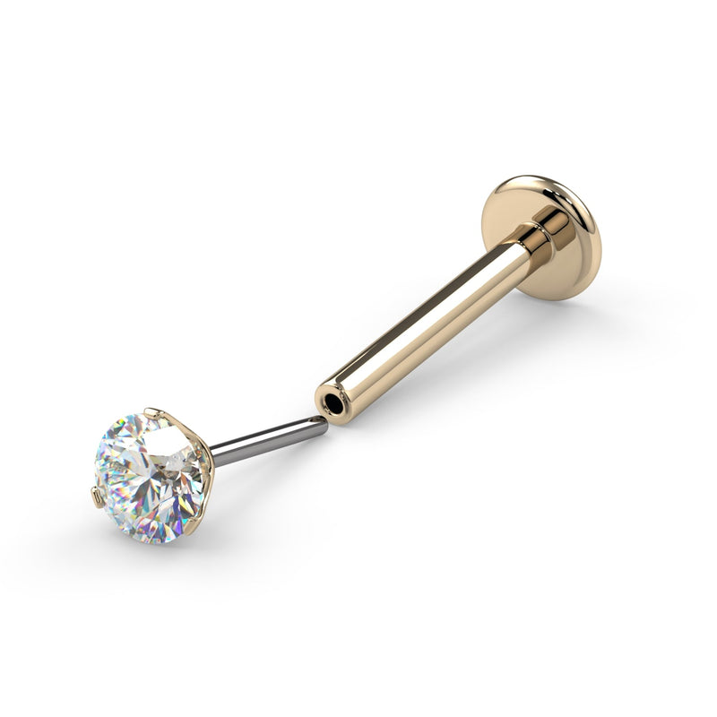 14k yellow gold threadless flat back labret shown with push-pin end detached, displaying assembly detail