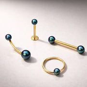 Peacock pearl 14K yellow gold barbell, curved barbell, labret, and captive ring styling options for replacement ball