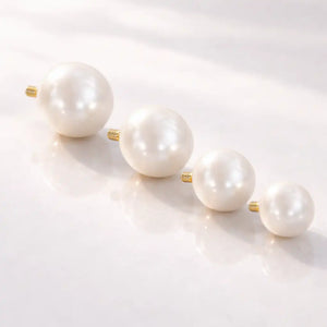 Four cultured pearl 14K gold internally threaded replacement balls showing size range from small to large