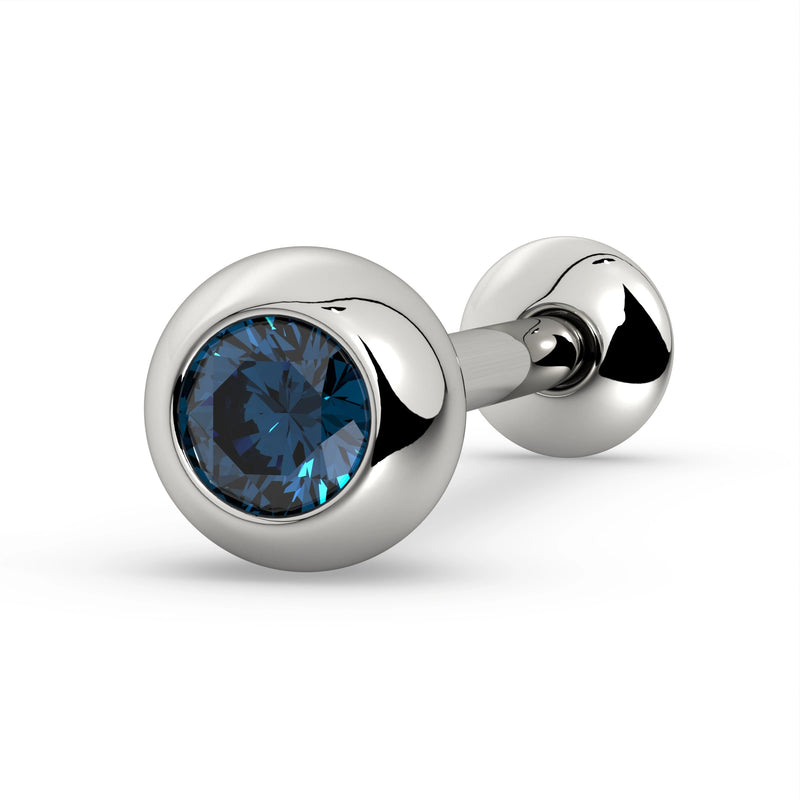 14K white gold tongue barbell with deep blue sapphire in solid bezel ball, angled close-up view