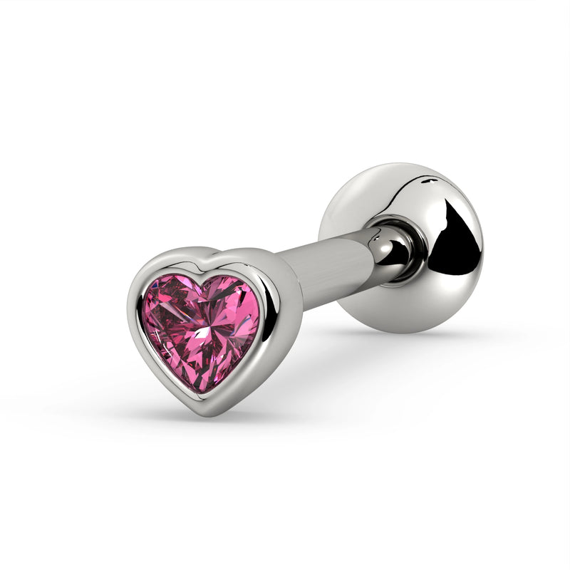 14k white gold tongue ring with bezel-set heart-cut pink sapphire, angled view showing gem and ball end
