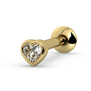 14k yellow gold tongue ring with bezel-set heart-cut white sapphire, angled view showing warm gold setting