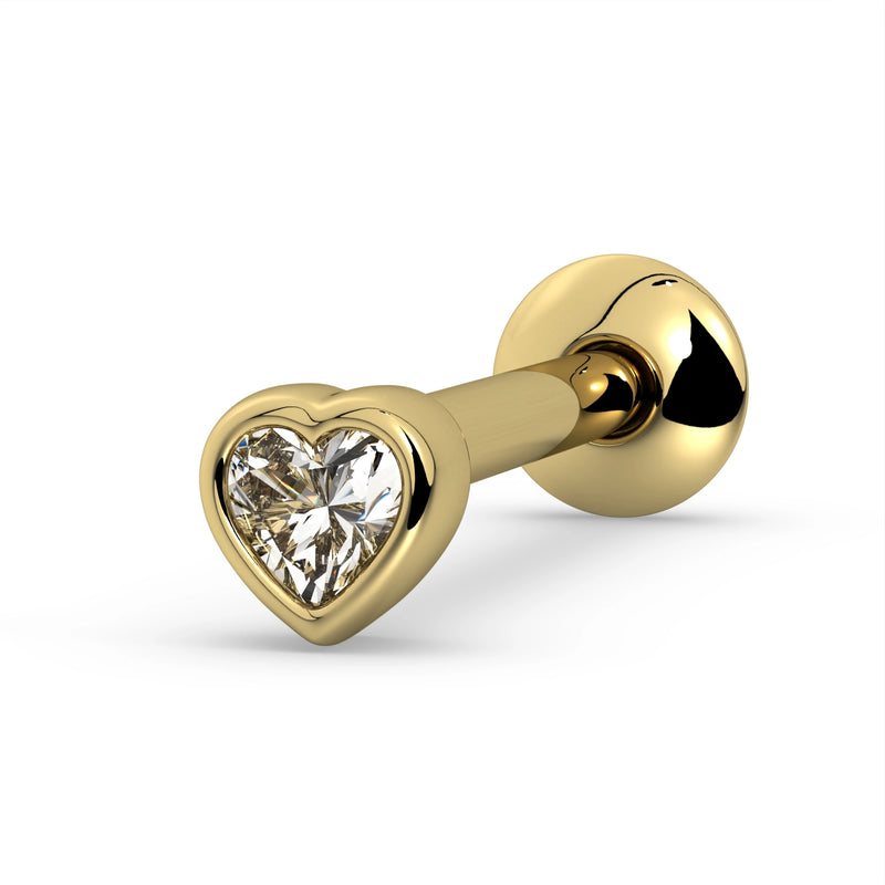 14k yellow gold tongue ring with bezel-set heart-cut white sapphire, angled view showing warm gold setting