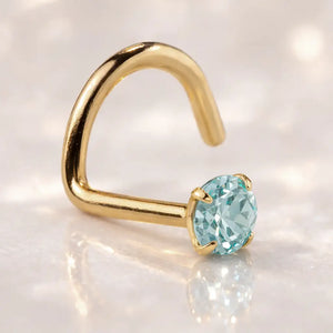 14K yellow gold aquamarine nose ring twist style with blue-green prong-set stone, lifestyle shot