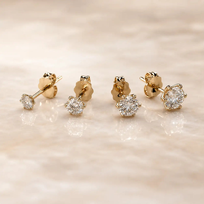 Four Astra Diamond Stud Earrings in various sizes