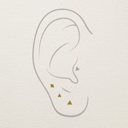 Diagram showing 14k gold trinity bead cluster studs placed at cartilage, conch, and lobe piercing locations