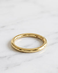 Belly button hoops - solid gold plain clicker hoop ring on white marble