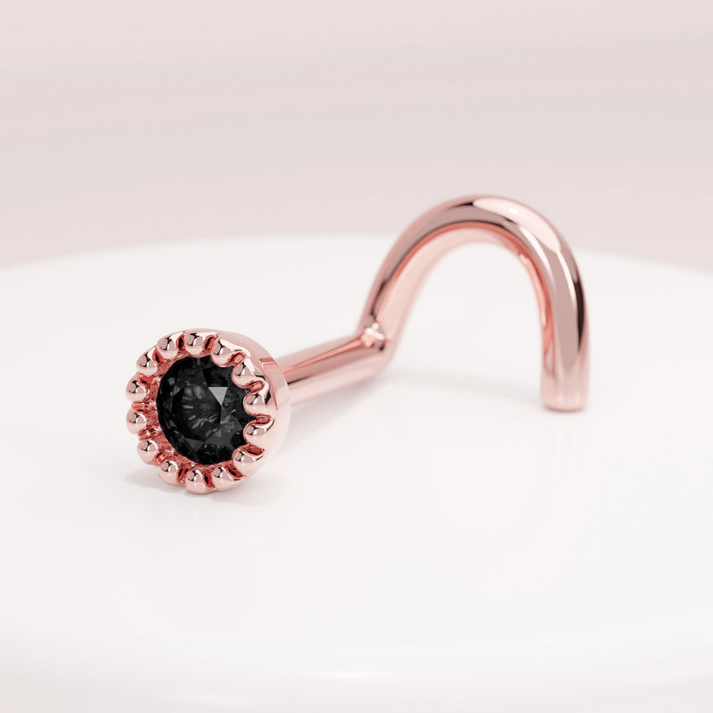 14k rose gold black diamond perlage nose ring twist style on white display, angled side view
