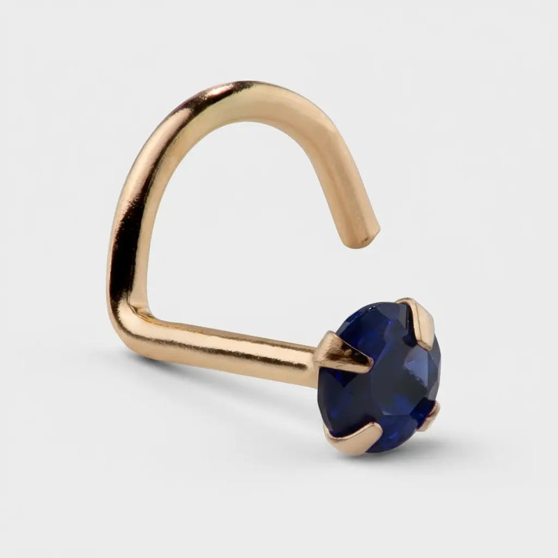 14K yellow gold genuine blue sapphire nose ring twist style, angled view showing corkscrew post