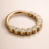14k yellow gold CZ bubble bezel seam ring, angled lifestyle shot showing bezel setting depth