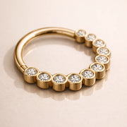 14k yellow gold CZ bubble bezel seam ring, angled lifestyle shot showing bezel setting depth
